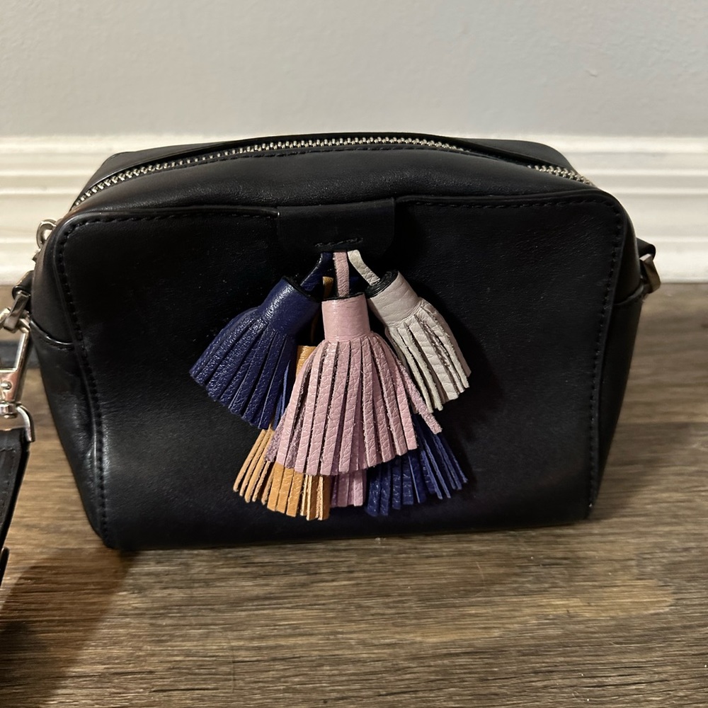 Rebecca Minkoff black leather crossbody bag with multi colored tassels